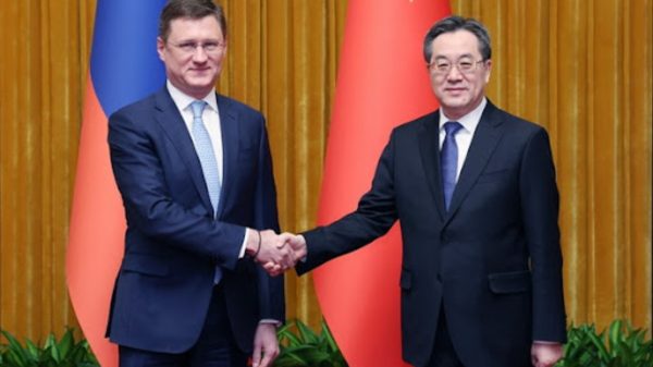 Chinese Vice Premier Ding Xuexiang and Russian Deputy PM Alexander Novak
