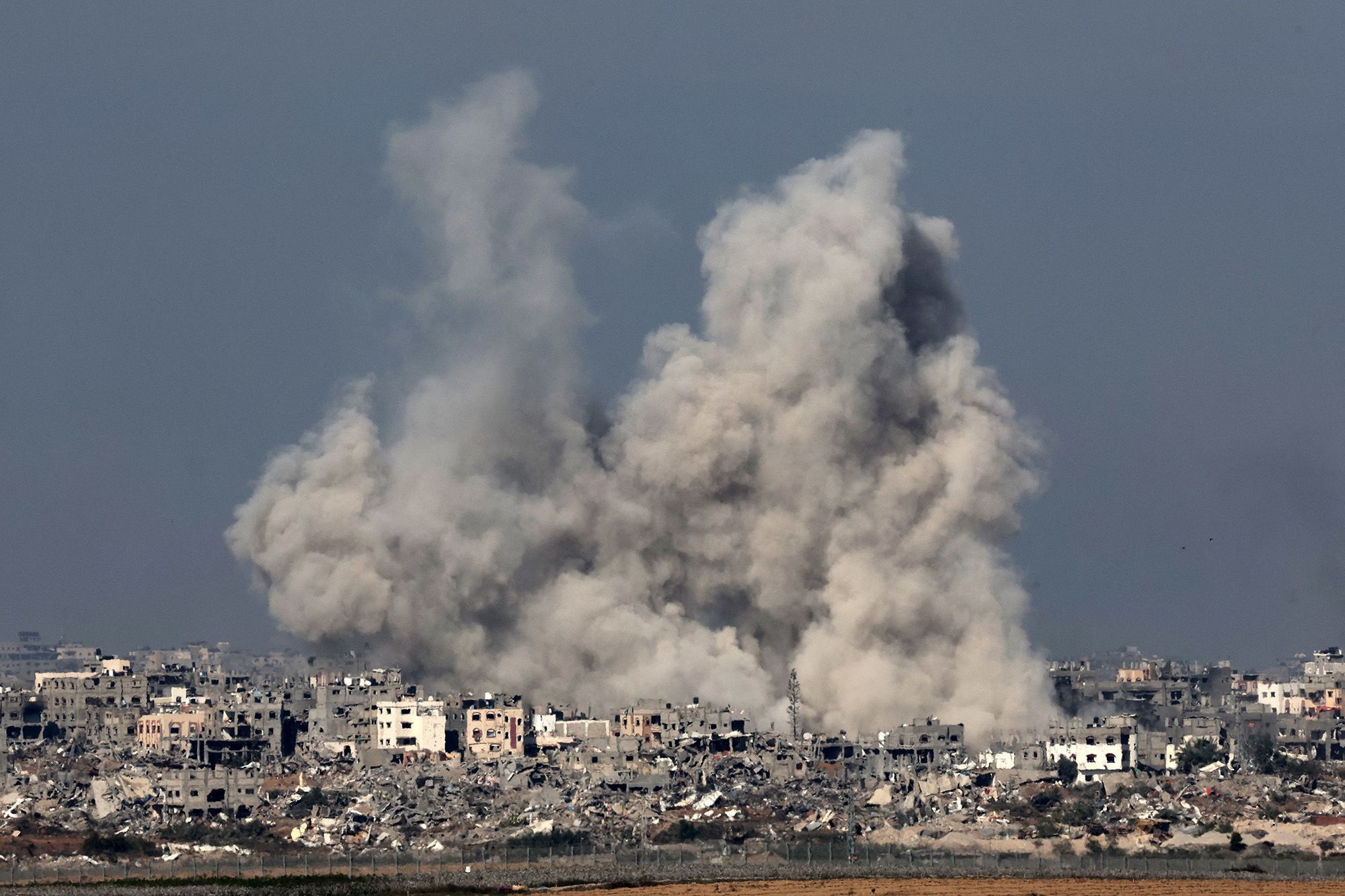 Gaza Airstrike Tragedy as Grieving Father Cradles Toddler's Body Amidst Conflict's Devastating Civilian Impact