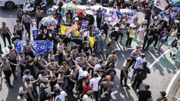 Protesters Face Intimidation and Police Inaction During Climate March in Jakarta, Raising Concerns Over Civil Liberties