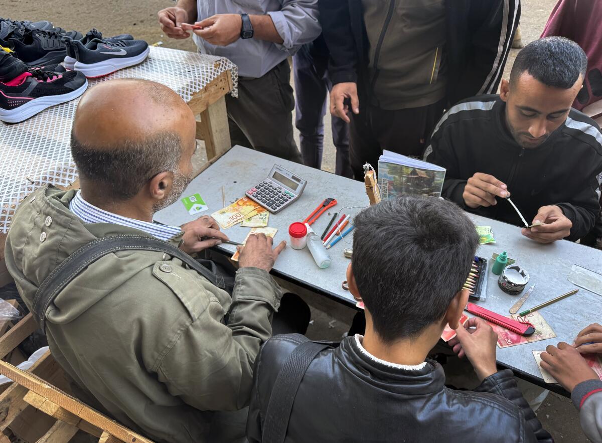 Jeweler-Turned-Money Repairman Helps Gaza Residents Navigate Cash Crisis Amid War and Blockade